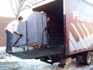 Grand piano unload off truck